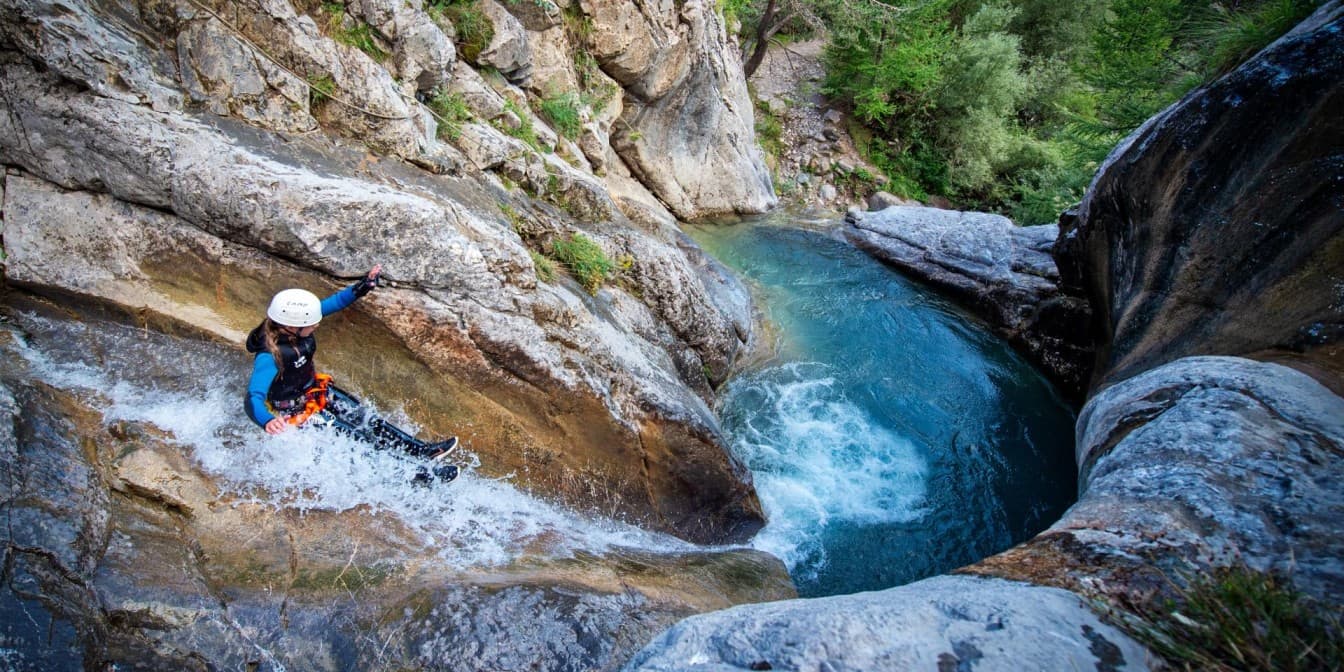 Family enjoying the beginner-friendly Emerald route with crystal clear water pools in Ardèche