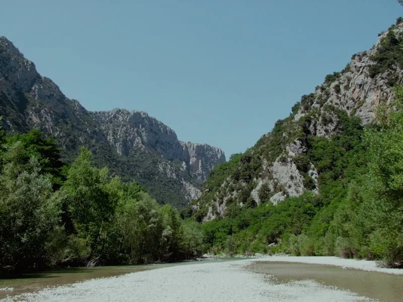 Aerial view of meandering Ardèche river with sparse canoe traffic