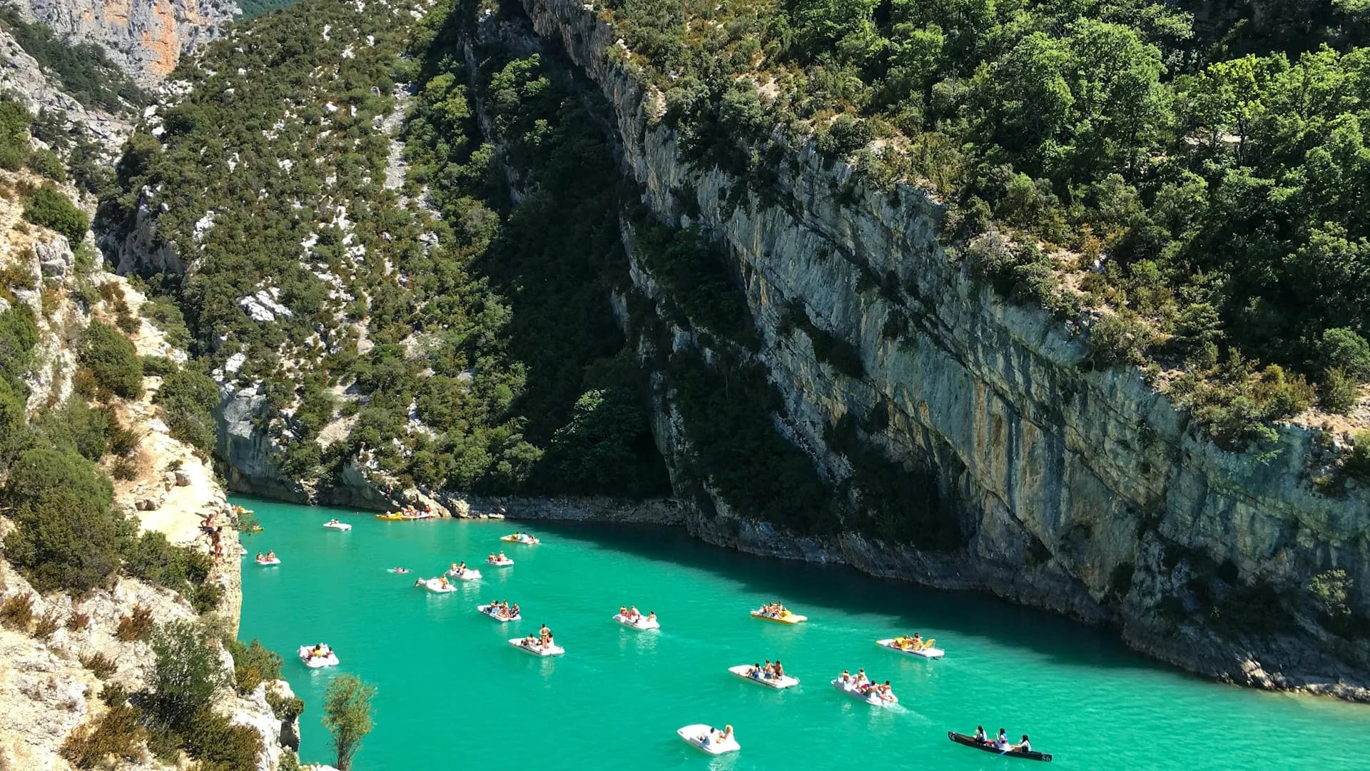 Stunning view of the Gorges de l'Ardèche with dramatic limestone cliffs and blue river